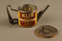 2018.426.10 a-b open
Kettle made from a can of Klim powdered milk and used by an American internee

Click to enlarge