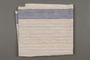 Tan, white, and blue striped hand towel with Hedwig Sanders Neu's initals that survived Kristallnacht