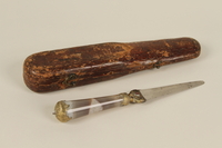 1992.8.27_a-b front
Circumcision knife with inscription and agate handle with wooden case used by a mohel

Click to enlarge