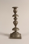 Pair of Sabbath candlesticks with wax reservoirs owned by a Jewish refugee