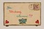 Envelope decorated with hearts and a hand drawn canceled stamp created by a former hidden child