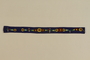 Blue felt belt with appliqued flowers found by a German Jewish teenage inmate at Auschwitz