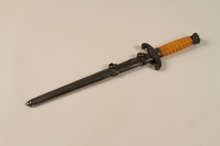 1989.10.2 closed
Yellow handled dagger with an engraved Reichsadler with sheath acquired by a US soldier

Click to enlarge