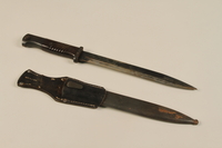 1989.10.4 open
Dagger with grooved handle and sheath acquired by a US soldier from German troops

Click to enlarge