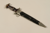 1989.10.5 closed
Wooden handled dagger with an embossed SA emblem and sheath acquired by a US soldier from German troops

Click to enlarge