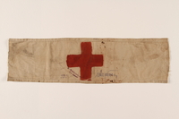 1993.90.5 front
White armband with a red cross worn by a concentration camp inmate

Click to enlarge