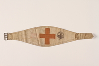 1995.105.5 front
White buckled armband with a red cross retrieved by a US soldier

Click to enlarge