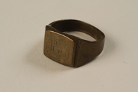 1995.105.8 front
Copper finger ring with a monogram received by a US soldier at a concentration camp

Click to enlarge