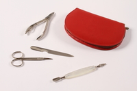 2013.476.5 a-e front
Set of four manicure tools in a red case brought by a German Jewish girl on a Kindertransport

Click to enlarge