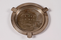 2013.496.2 top
Silver plated ashtray with an engraving of Skansen Kronan acquired by a former concentration camp inmate

Click to enlarge