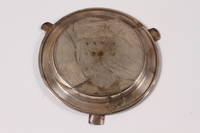 2013.496.2 bottom
Silver plated ashtray with an engraving of Skansen Kronan acquired by a former concentration camp inmate

Click to enlarge