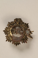1989.243.273 front
Shanghai Volunteer Corps badge issued to a Jewish refugee in Shanghai

Click to enlarge