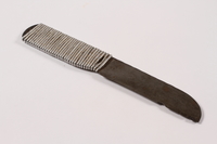 2013.379.7 right side
Handmade metal knife used by a concentration camp inmate saved by getting on Schindler's list

Click to enlarge