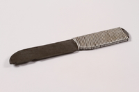 2013.379.7 left side
Handmade metal knife used by a concentration camp inmate saved by getting on Schindler's list

Click to enlarge