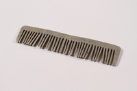 2013.379.8 right side
Handmade metal comb used by a concentration camp inmate saved by getting on Schindler's list

Click to enlarge