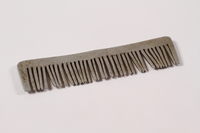 2013.379.8 left side
Handmade metal comb used by a concentration camp inmate saved by getting on Schindler's list

Click to enlarge