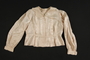 Satin blouse with a scalloped collar worn by a Roma woman