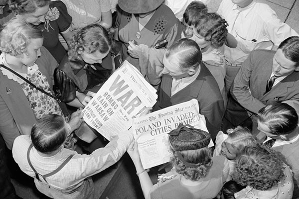 People look at Washington, DC, newspapers on September 1, 1939—the day Nazi Germany invaded Poland, starting World War II. <i>Harris & Ewing Collection/Library of Congress</i>